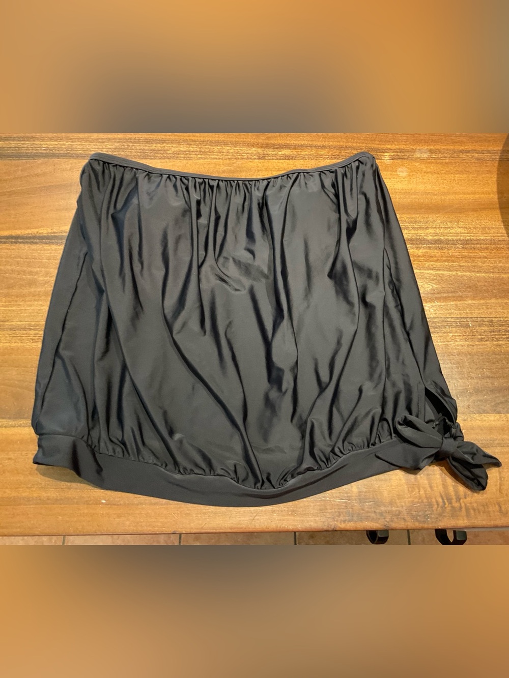black blouson-style swim top with built in bra